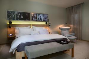 Postel nebo postele na pokoji v ubytování Billini Hotel, Historic Luxury