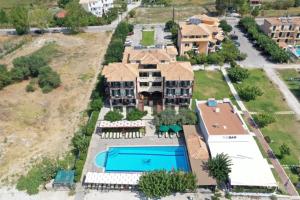 an aerial view of a large house with a swimming pool at Porto Fico Hotel in Vasiliki