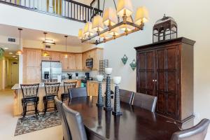 a dining room and kitchen with a table and chairs at Seasons 331 - Penthouse in Sandpoint