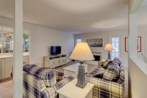 a living room with a couch and a table at 2 Bed 2 Bath Villa in Island,Shipyard - Hilton Head in Hilton Head Island