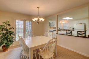 a dining room and kitchen with a table and chairs at 2 Bed 2 Bath Villa in Island,Shipyard - Hilton Head in Hilton Head Island