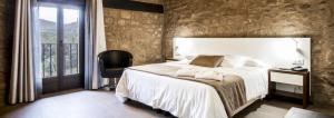 Ein Bett oder Betten in einem Zimmer der Unterkunft Hotel Restaurante Masía la Torre