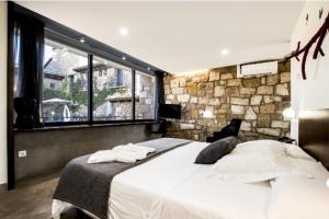 Ein Bett oder Betten in einem Zimmer der Unterkunft Hotel Restaurante Masía la Torre