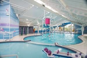 a large indoor swimming pool in a building at 3 Bedroom at Seton Sands Caravan Hire in Edinburgh
