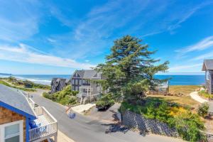an aerial view of a house with the ocean in the background at Anchor Away at Lincoln City in Lincoln City