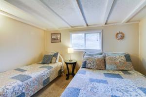 En eller flere senge i et værelse på Pelican's Perch