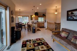 a living room with a couch and a table at Picture Perfect Panoramic Paradise in Twin Beaches