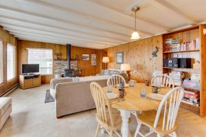 a living room with a table and a couch at Pelican's Perch in Florence