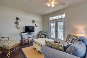 a living room with a couch and a tv at Broad Marsh Beach House in Ocean City