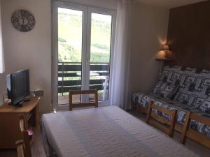 Postel nebo postele na pokoji v ubytování Appartement pied des pistes 4 à 6 pers - Les Deux-Alpes + 7 fotografií