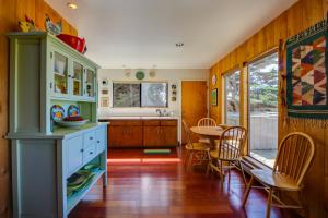 a kitchen with a table and a dining room at Bowsprit Retreat in Sea Ranch