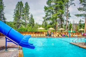 a slide in a swimming pool at a resort at Chamonix Chalet in Truckee