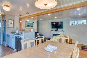 a kitchen and dining room with a table and chairs at Rockaway Beach Bungalow in Rockaway Beach