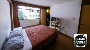 מיטה או מיטות בחדר ב-Kame House hostel