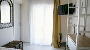 TV a/nebo společenská místnost v ubytování Il nido dei gufi