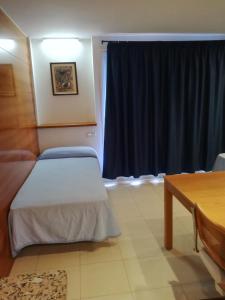 Postel nebo postele na pokoji v ubytování Hotel Platja d'Aro