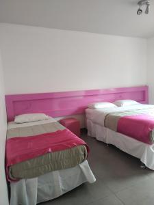 Llit o llits en una habitació de Concept Design Hostel & Suites
