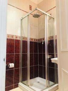 a shower with a glass enclosure in a bathroom at Norfolk House in Maidenhead