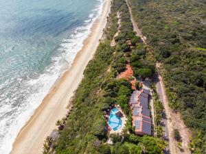 an aerial view of a resort next to the beach at Hotel Ponta do Madeiro in Pipa