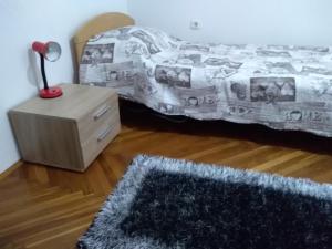 En eller flere senge i et værelse på Apartment Giardino
