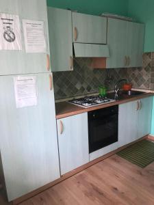 A kitchen or kitchenette at Francesco Apartment Olbia