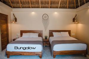 Postel nebo postele na pokoji v ubytování Hotel CasaBakal - A pie de Laguna - Bacalar