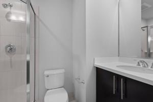 a bathroom with a toilet and a sink and a shower at Global Luxury Suites at The White House in Washington +22 photos