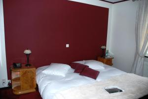 Letto o letti in una camera di Hostellerie de Genève
