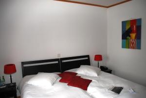 Letto o letti in una camera di Hostellerie de Genève