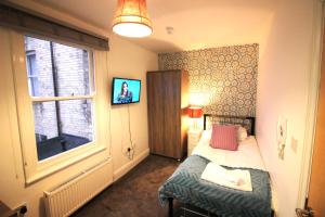 Katil atau katil-katil dalam bilik di Cambridge City Rooms by Paymán Club
