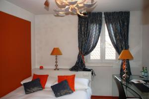 Letto o letti in una camera di Hostellerie de Genève