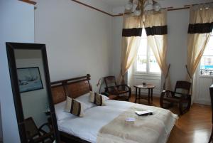 Letto o letti in una camera di Hostellerie de Genève