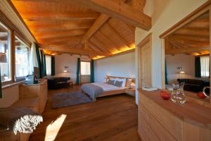 Voodi või voodid majutusasutuse Chalet Grumer Suites&Spa toas