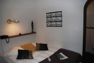Letto o letti in una camera di Hostellerie de Genève