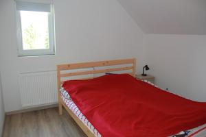 Un pat sau paturi într-o cameră la Óhuta