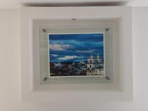 a view of a city through a window at Apartments and Rooms Distecon in Guatemala