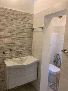a bathroom with a sink and a toilet at House S&D in Giarre +63 photos