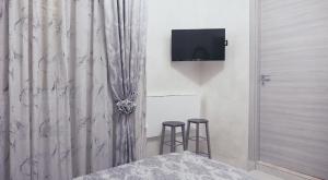 A television and/or entertainment centre at L'Antenna