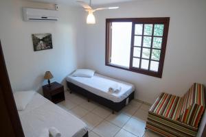 Ліжко або ліжка в номері Solar Capitão Gancho