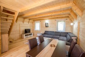 a living room with a couch and a table at Paradise Zabljak in Žabljak