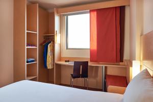 Cama ou camas em um quarto em Ibis Cancun Centro