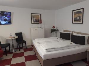 Postel nebo postele na pokoji v ubytování Hotel Luca