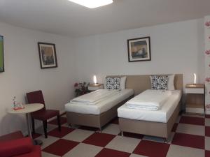 Postel nebo postele na pokoji v ubytování Hotel Luca