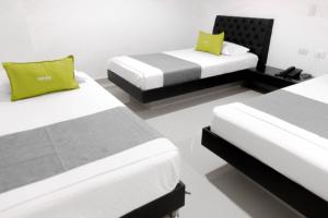 Postel nebo postele na pokoji v ubytování 3H hotel centro histórico