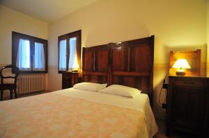 Łóżko lub łóżka w pokoju w obiekcie Locanda Sant'Anna Hotel