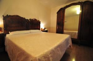 Łóżko lub łóżka w pokoju w obiekcie Locanda Sant'Anna Hotel