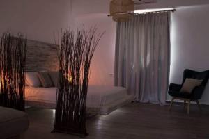 Letto o letti in una camera di VILLA AKTI