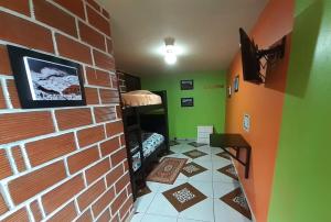 TV a/nebo společenská místnost v ubytování Hostal Sendero de Volcanes + 31 fotografií