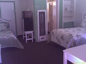 Katil atau katil-katil dalam bilik di Ranch Motel