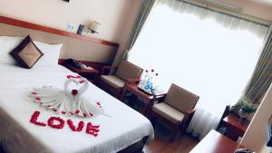 Postel nebo postele na pokoji v ubytování Paradis Hotel